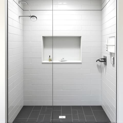 Before and after of a guest bathroom remodeled into a walk-in shower with convenient built-in niche storage and integrated seating, perfect for San Antonio residences. This image shows a functional and stylish bathroom upgrade for enhanced homeowner comfort and organization.